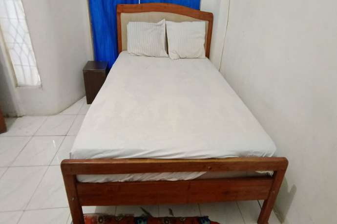 Imagen de la habitación del Hotel OYO 93122 Pondok Puti Sartika Syariah. Foto 8