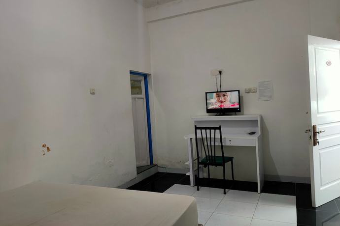Imagen de la habitación del Hotel OYO 93122 Pondok Puti Sartika Syariah. Foto 12
