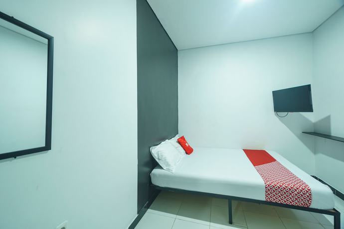 Imagen de la habitación del Hotel OYO 93133 Moraja. Foto 3