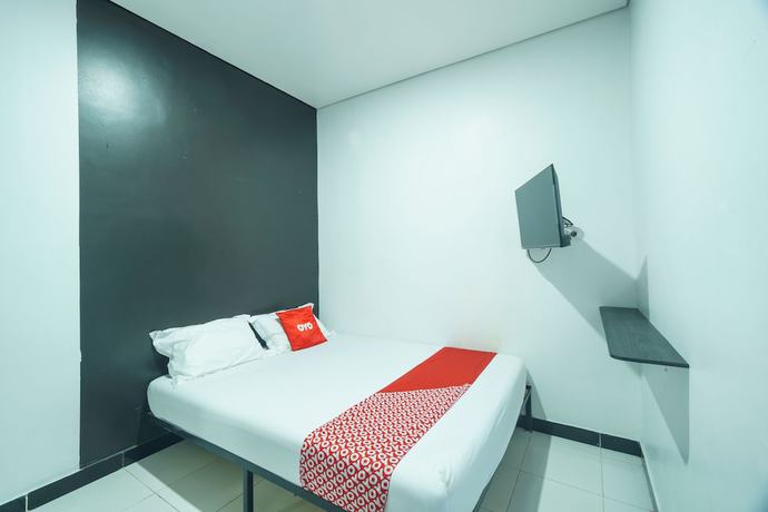 Imagen de la habitación del Hotel OYO 93133 Moraja. Foto 4