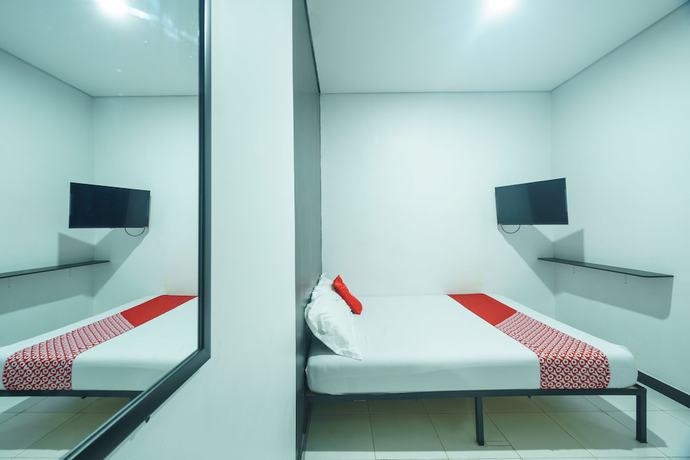 Imagen de la habitación del Hotel OYO 93133 Moraja. Foto 6