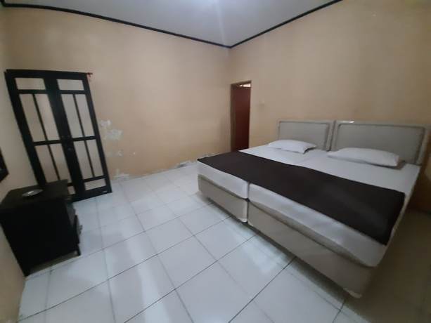 Imagen de la habitación del Hotel OYO 93135 Wisma Bayt Hikmah. Foto 2
