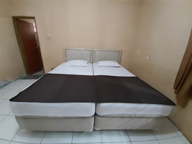 Imagen de la habitación del Hotel OYO 93135 Wisma Bayt Hikmah. Foto 6