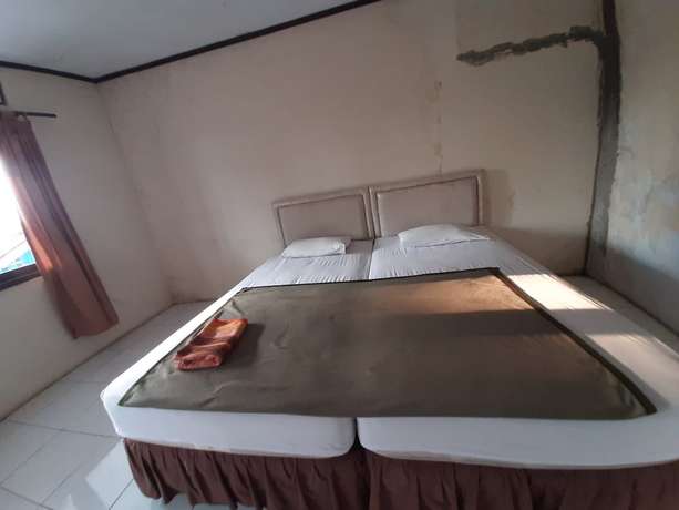 Imagen de la habitación del Hotel OYO 93135 Wisma Bayt Hikmah. Foto 7