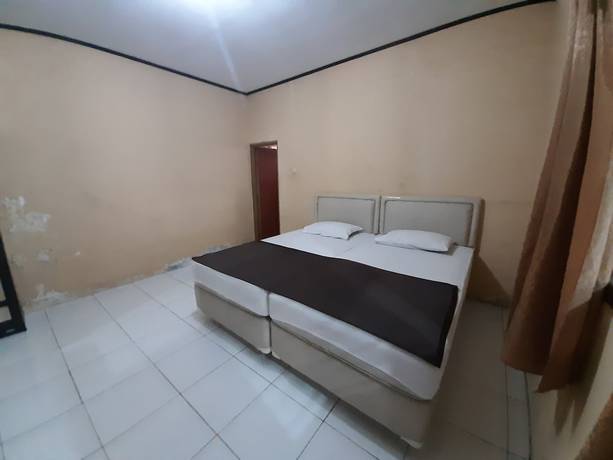 Imagen de la habitación del Hotel OYO 93135 Wisma Bayt Hikmah. Foto 8
