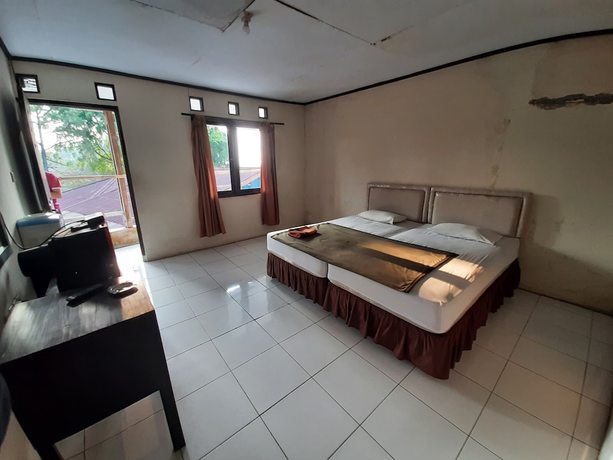 Imagen de la habitación del Hotel OYO 93135 Wisma Bayt Hikmah. Foto 9