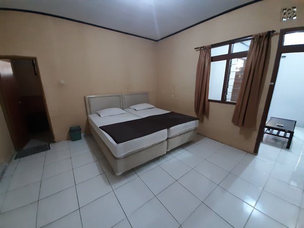 Imagen de la habitación del Hotel OYO 93135 Wisma Bayt Hikmah. Foto 11