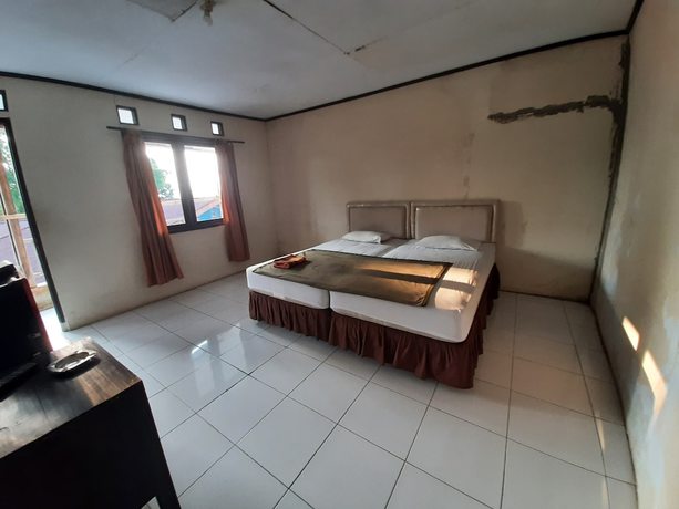 Imagen de la habitación del Hotel OYO 93135 Wisma Bayt Hikmah. Foto 13