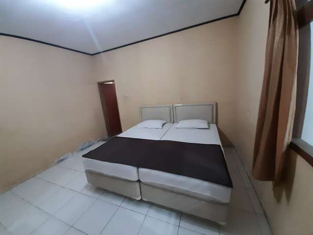 Imagen de la habitación del Hotel OYO 93135 Wisma Bayt Hikmah. Foto 14