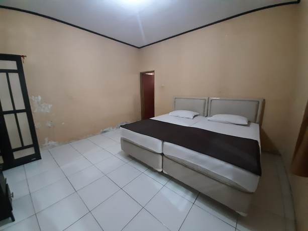 Imagen de la habitación del Hotel OYO 93135 Wisma Bayt Hikmah. Foto 15