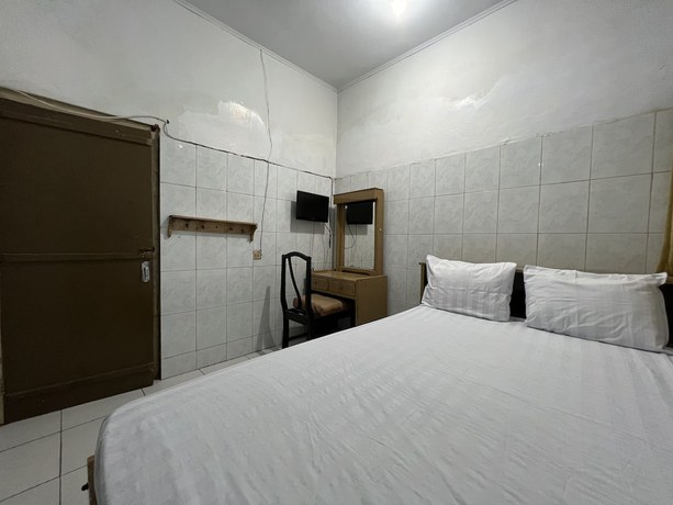 Imagen de la habitación del Hotel OYO 93137 Kost Maharaja. Foto 10