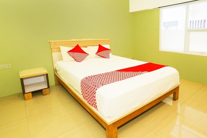 Imagen de la habitación del Hotel OYO 93145 Pondok Alam Syariah, Depok. Foto 8
