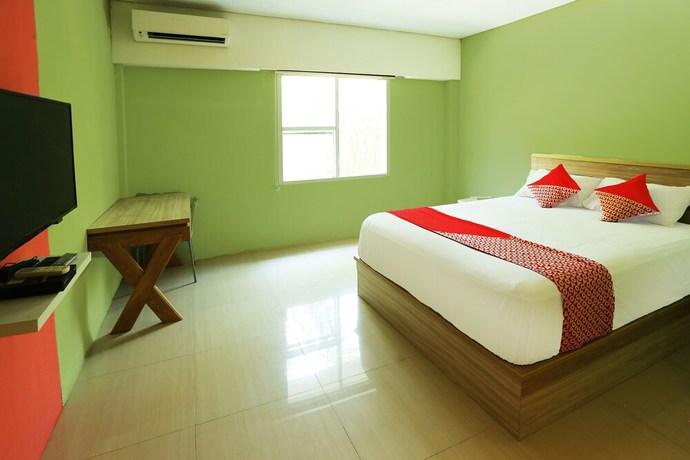 Imagen de la habitación del Hotel OYO 93145 Pondok Alam Syariah, Depok. Foto 11