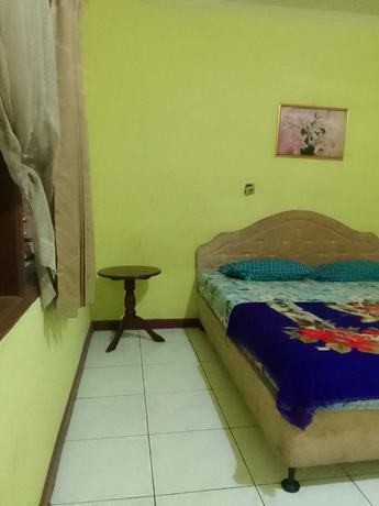 Imagen de la habitación del Hotel OYO 93146 Lamin Indah. Foto 3