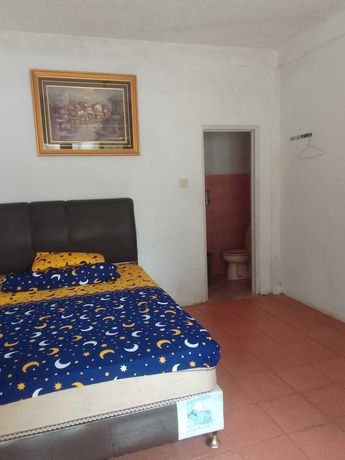 Imagen de la habitación del Hotel OYO 93146 Lamin Indah. Foto 4