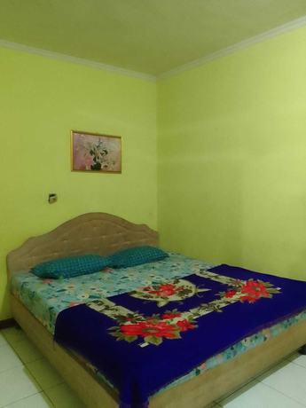 Imagen de la habitación del Hotel OYO 93146 Lamin Indah. Foto 8