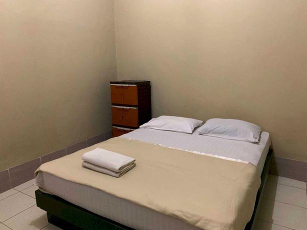 Imagen de la habitación del Hotel OYO 93165 Nur Homestay Syariah. Foto 3