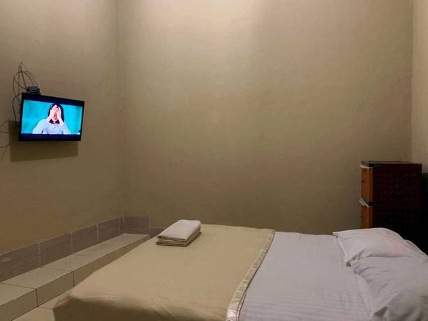 Imagen de la habitación del Hotel OYO 93165 Nur Homestay Syariah. Foto 4