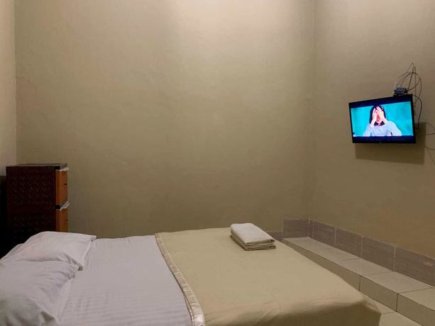 Imagen de la habitación del Hotel OYO 93165 Nur Homestay Syariah. Foto 5