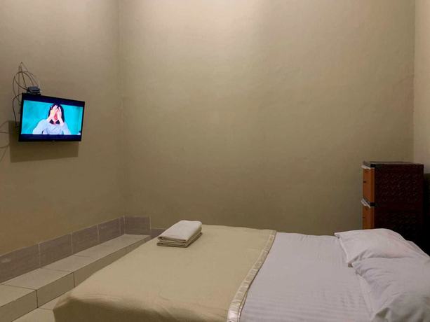 Imagen de la habitación del Hotel OYO 93165 Nur Homestay Syariah. Foto 6