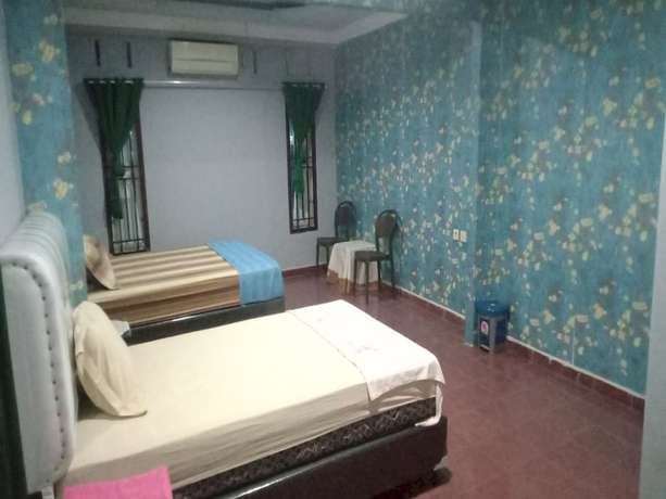 Imagen de la habitación del Hotel OYO 93292 Raudhatul Husna Homestay Syariah. Foto 2