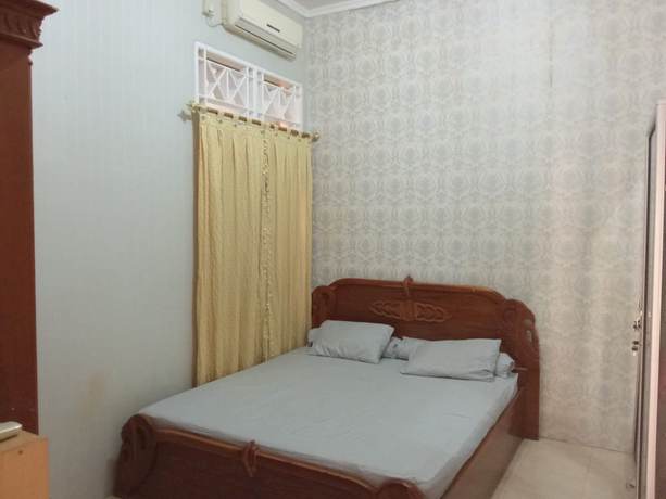 Imagen de la habitación del Hotel OYO 93292 Raudhatul Husna Homestay Syariah. Foto 3