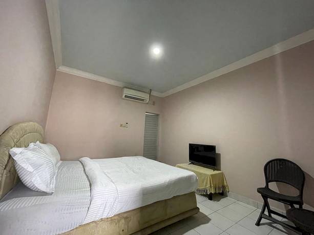 Imagen de la habitación del Hotel OYO 93292 Raudhatul Husna Homestay Syariah. Foto 4