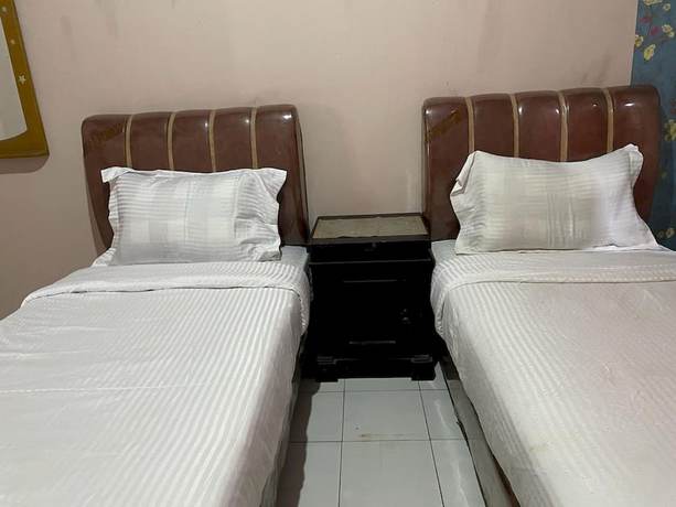 Imagen de la habitación del Hotel OYO 93292 Raudhatul Husna Homestay Syariah. Foto 5