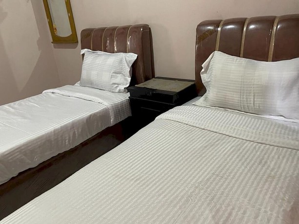 Imagen de la habitación del Hotel OYO 93292 Raudhatul Husna Homestay Syariah. Foto 6