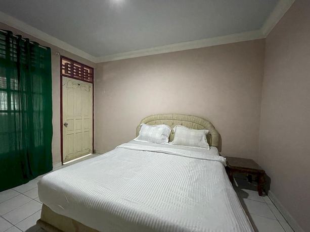 Imagen de la habitación del Hotel OYO 93292 Raudhatul Husna Homestay Syariah. Foto 7