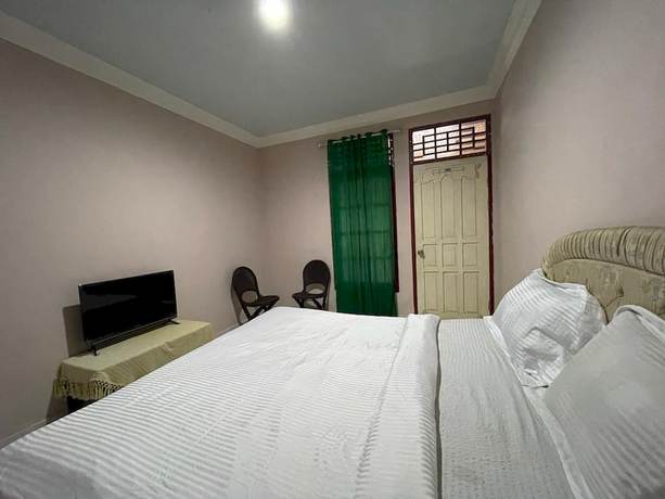 Imagen de la habitación del Hotel OYO 93292 Raudhatul Husna Homestay Syariah. Foto 8
