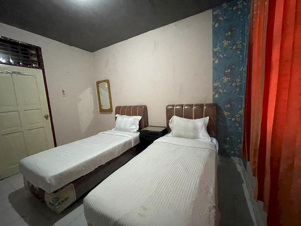 Imagen de la habitación del Hotel OYO 93292 Raudhatul Husna Homestay Syariah. Foto 9