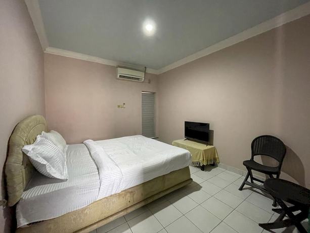 Imagen de la habitación del Hotel OYO 93292 Raudhatul Husna Homestay Syariah. Foto 10