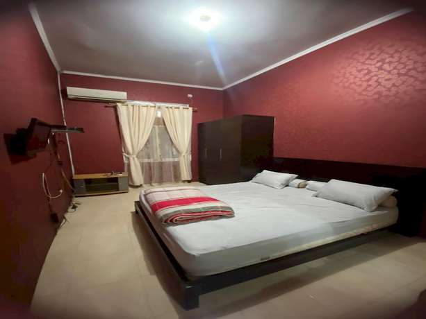 Imagen de la habitación del Hotel OYO 93292 Raudhatul Husna Homestay Syariah. Foto 12
