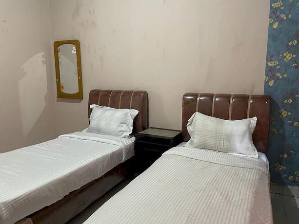 Imagen de la habitación del Hotel OYO 93292 Raudhatul Husna Homestay Syariah. Foto 14