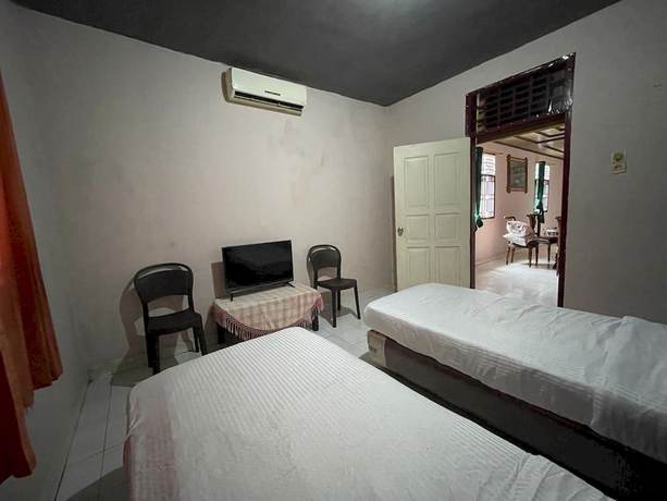 Imagen de la habitación del Hotel OYO 93292 Raudhatul Husna Homestay Syariah. Foto 16