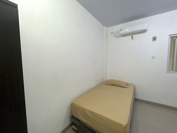 Imagen de la habitación del Hotel OYO 93297 Penginapan Musafir Syariah. Foto 4