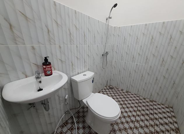 Imagen de la habitación del Hotel OYO 93306 Homestay Permana Supadio Airport. Foto 4
