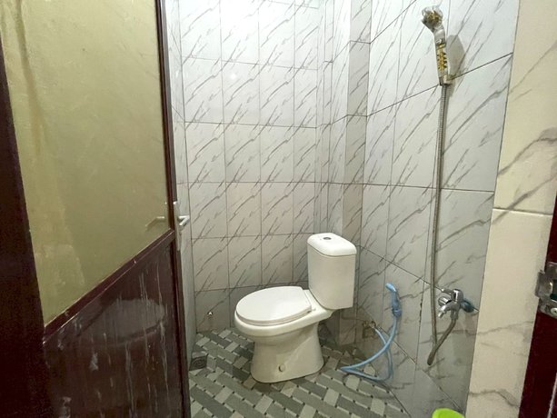 Imagen de la habitación del Hotel OYO 93306 Kos Citra Syariah. Foto 3