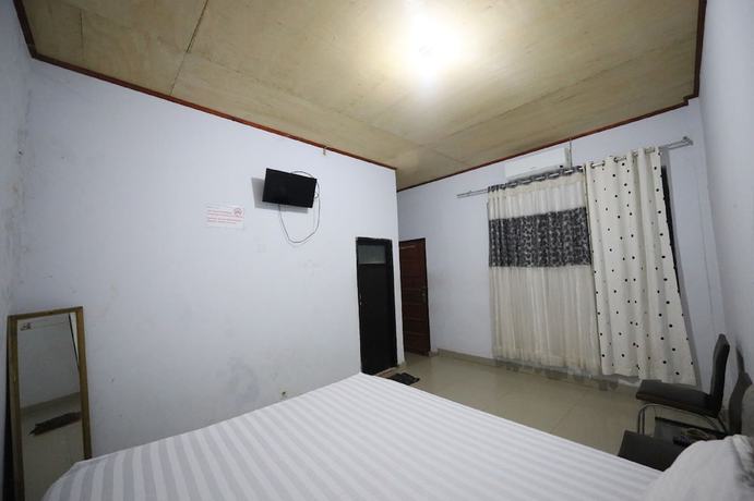 Imagen de la habitación del Hotel OYO 93306 Kos Citra Syariah. Foto 4