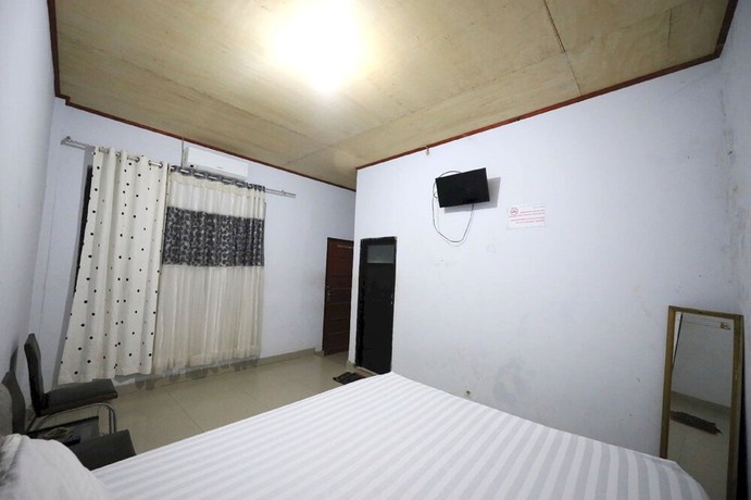 Imagen de la habitación del Hotel OYO 93306 Kos Citra Syariah. Foto 5