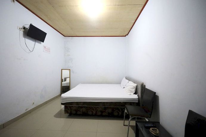 Imagen de la habitación del Hotel OYO 93306 Kos Citra Syariah. Foto 6