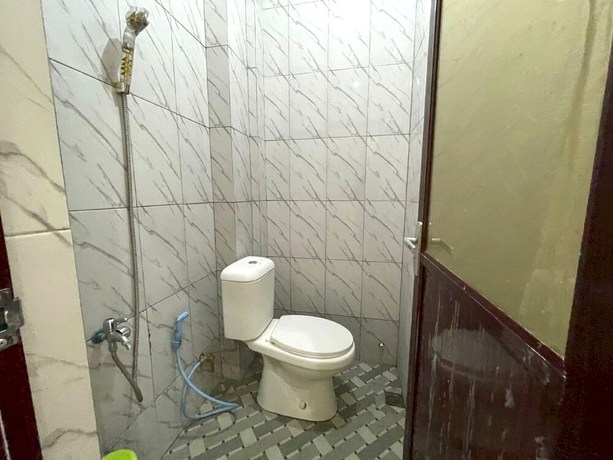 Imagen de la habitación del Hotel OYO 93306 Kos Citra Syariah. Foto 7