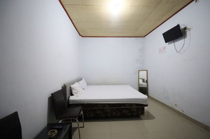 Imagen de la habitación del Hotel OYO 93306 Kos Citra Syariah. Foto 8