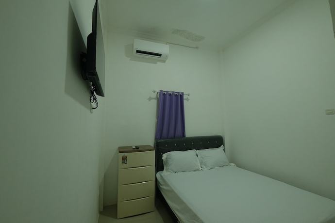 Imagen de la habitación del Hotel OYO 93306 Penginapan Permata Hijau Syariah. Foto 3