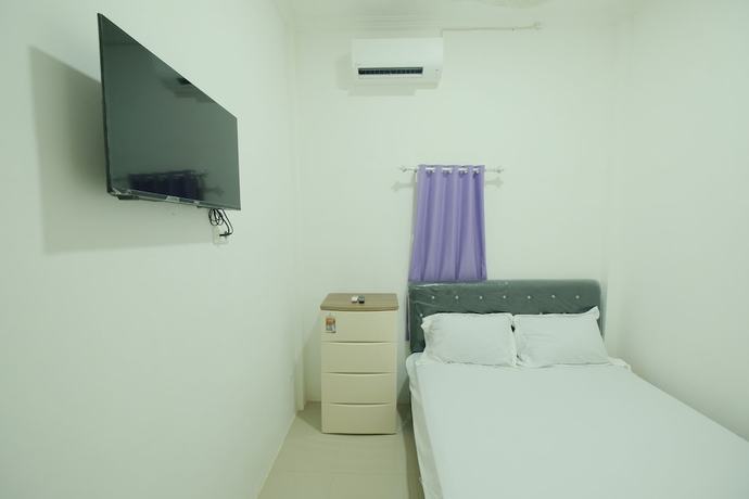 Imagen de la habitación del Hotel OYO 93306 Penginapan Permata Hijau Syariah. Foto 4