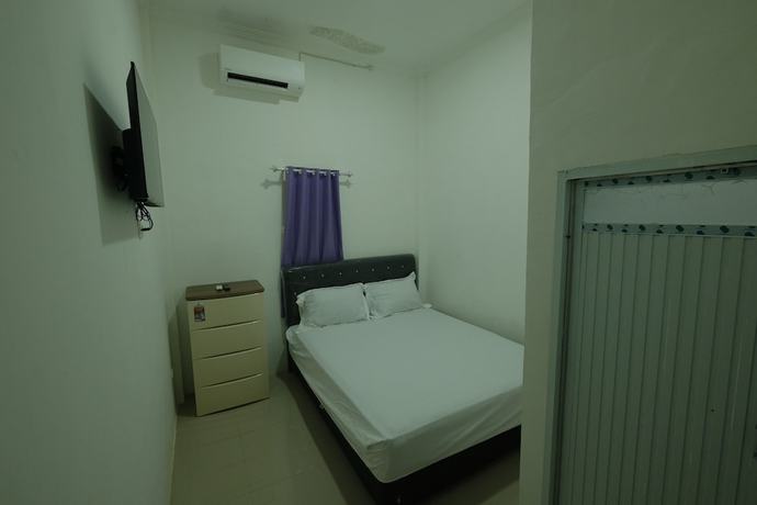 Imagen de la habitación del Hotel OYO 93306 Penginapan Permata Hijau Syariah. Foto 6