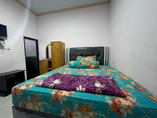 Imagen de la habitación del Hotel OYO 93308 Lima Saudara Syariah. Foto 2