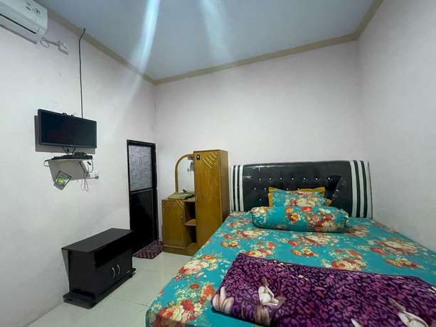 Imagen de la habitación del Hotel OYO 93308 Lima Saudara Syariah. Foto 4