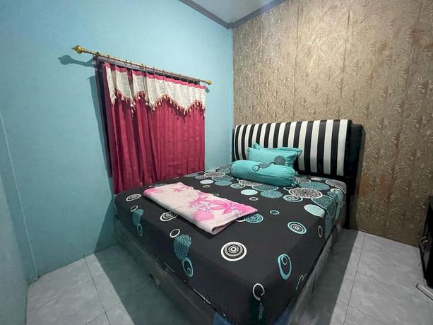 Imagen de la habitación del Hotel OYO 93308 Lima Saudara Syariah. Foto 5